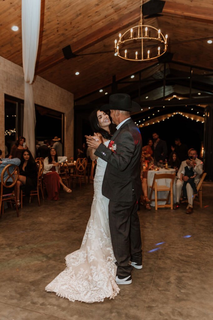 father daughter dance at a wedding at the red earth venue in moab utah
