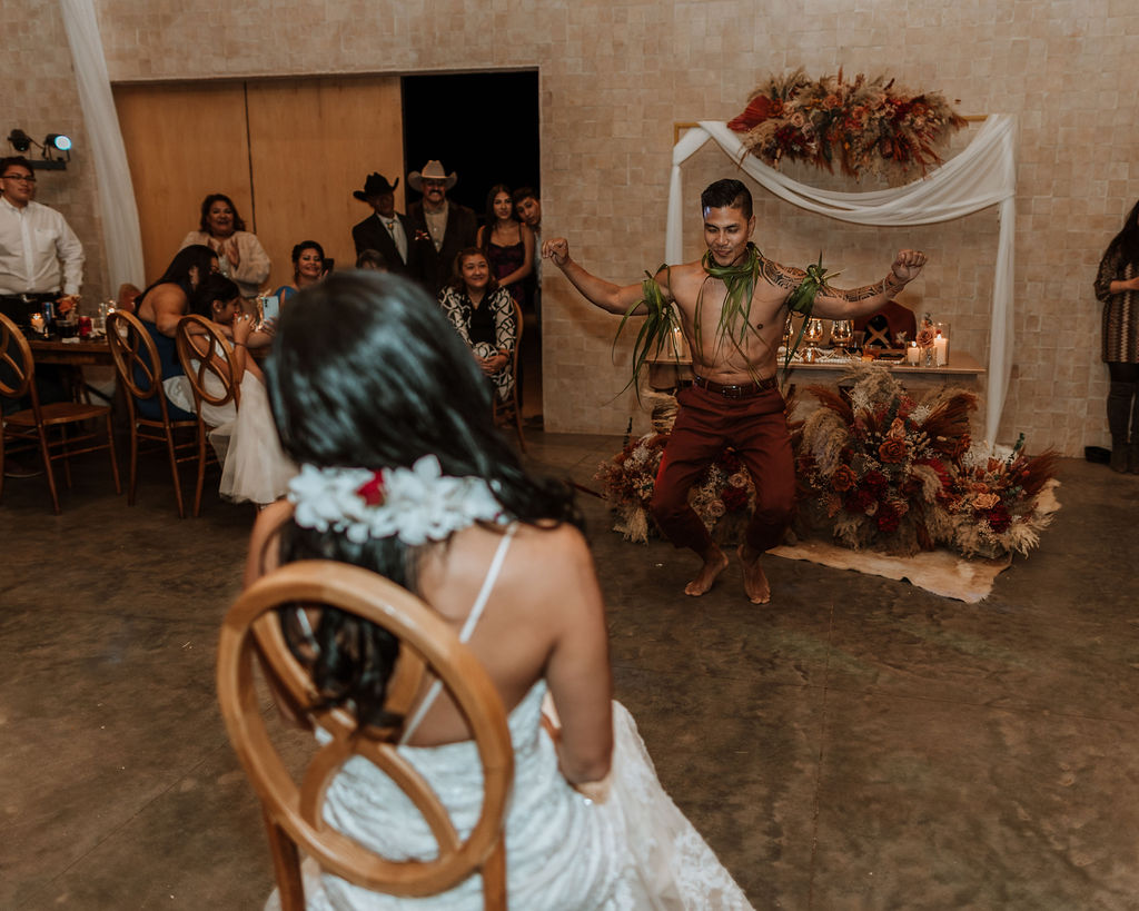 shirtless groom dancing for the bride