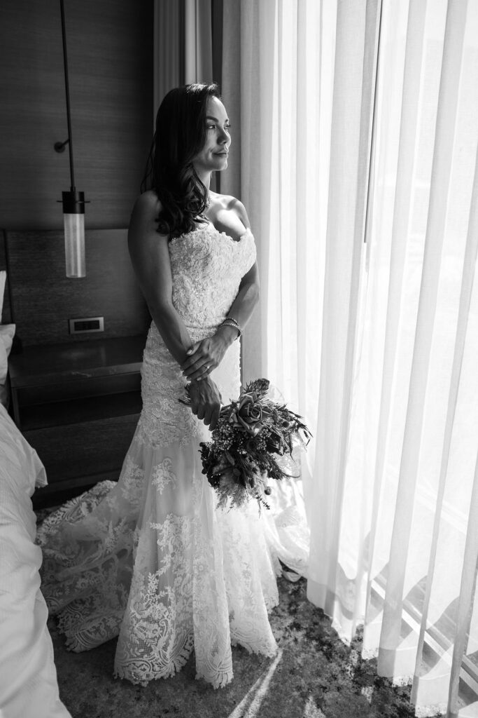 Stunning bride with her terracotta bouquet in black and white