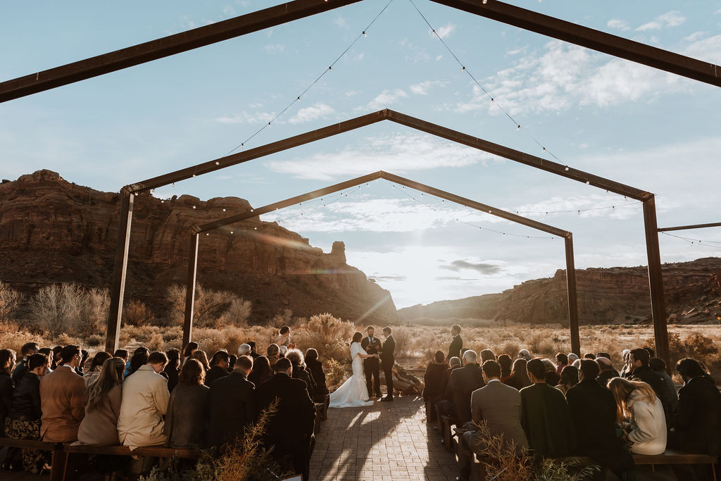 couple exchanges vows at outdoor winter wedding in Moab