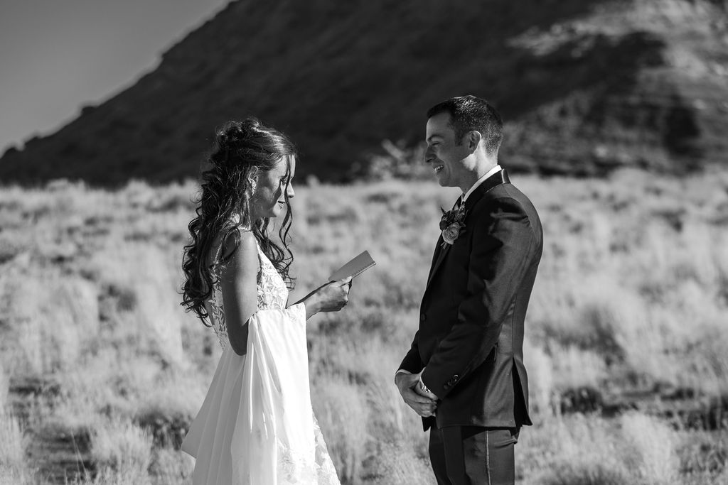 couple exchanges wedding vows in Moab field