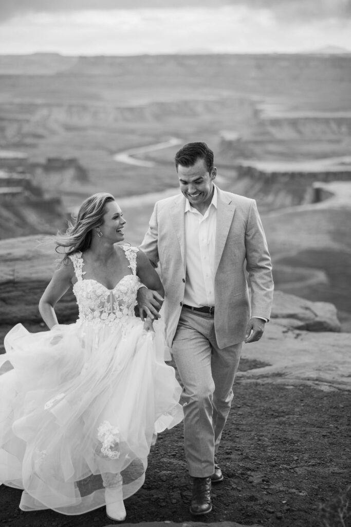 couple walks together at Moab elopement