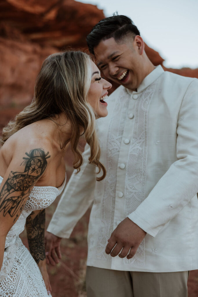 couple embraces at Moab desert elopement