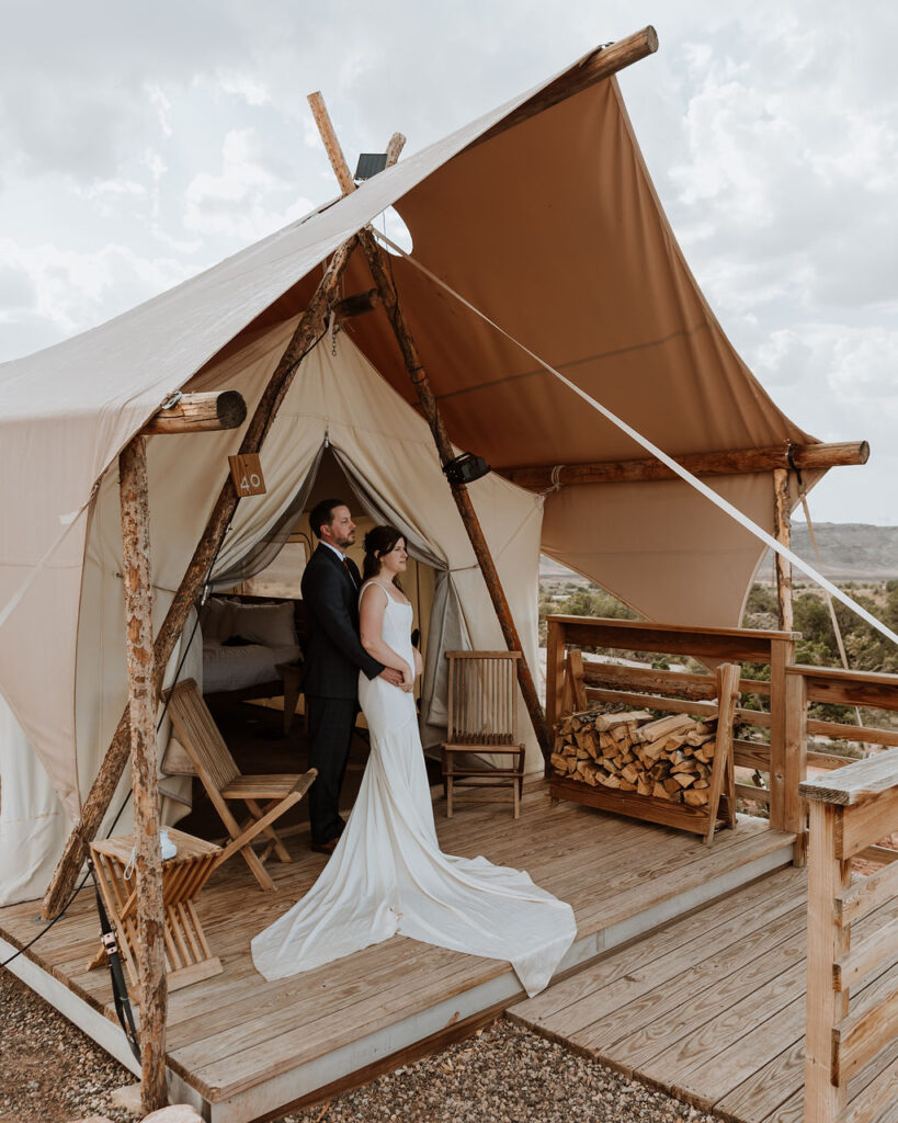 couple embraces at Under Canvas Moab tent