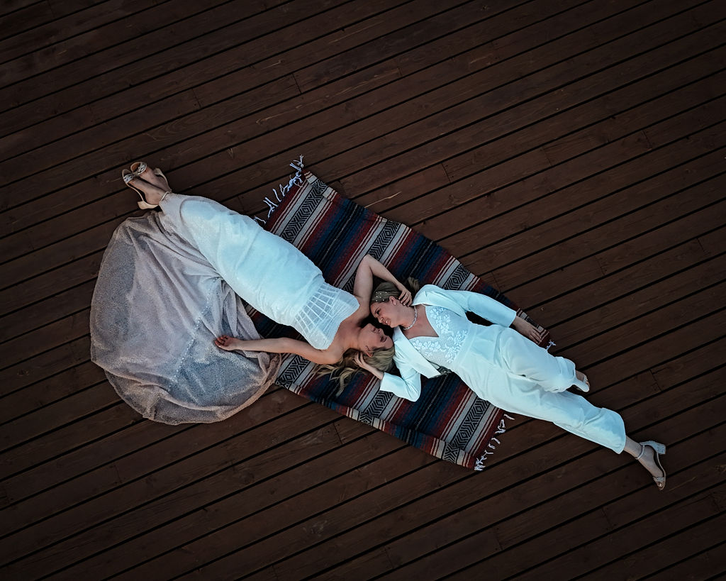 couple lies on blanket together