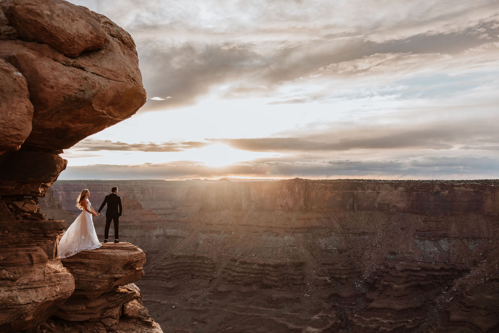 couple poses at Dead Horse Point Overlook