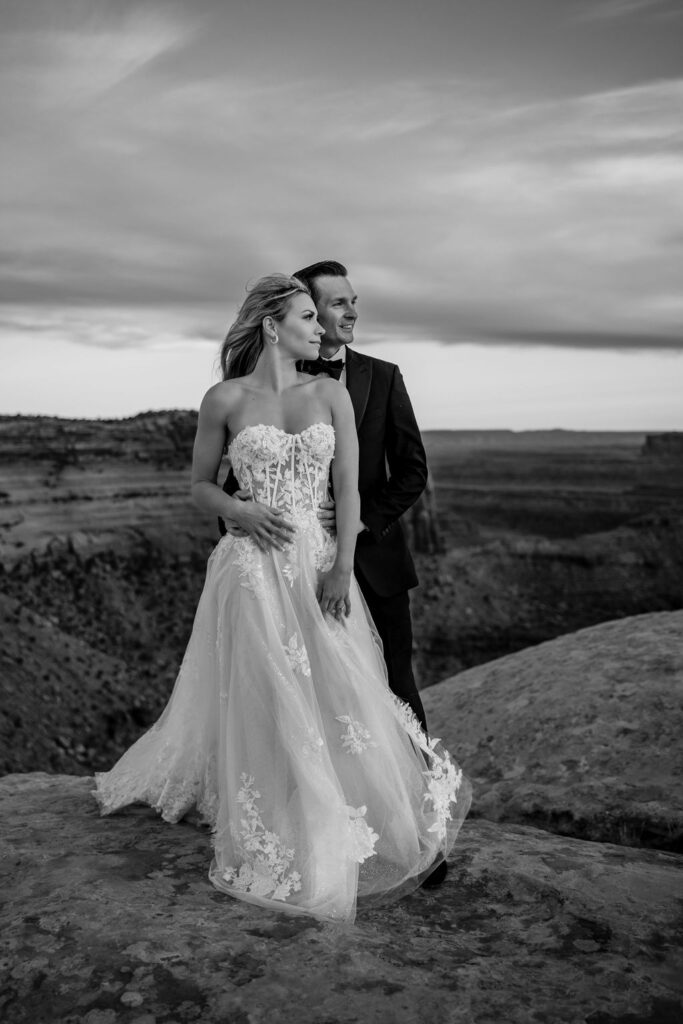 couple poses at Dead Horse Point Overlook