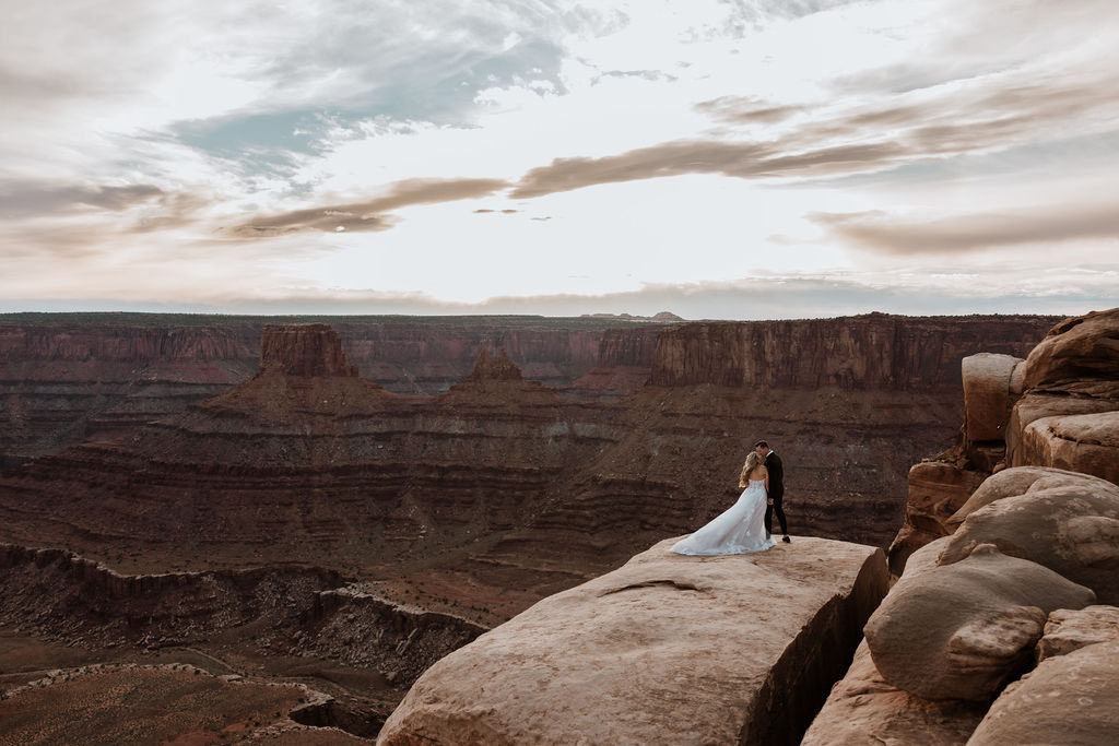 couple kisses at Dead Horse Point Overlook