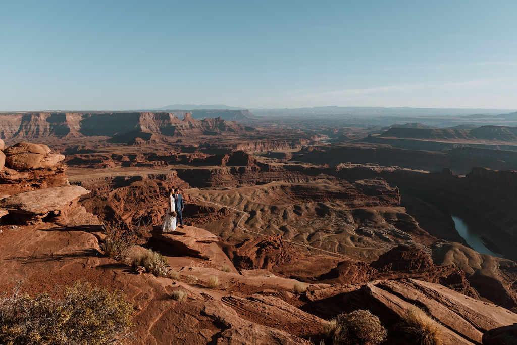 couple holds hands at Dead Horse Point State Park Moab elopement 