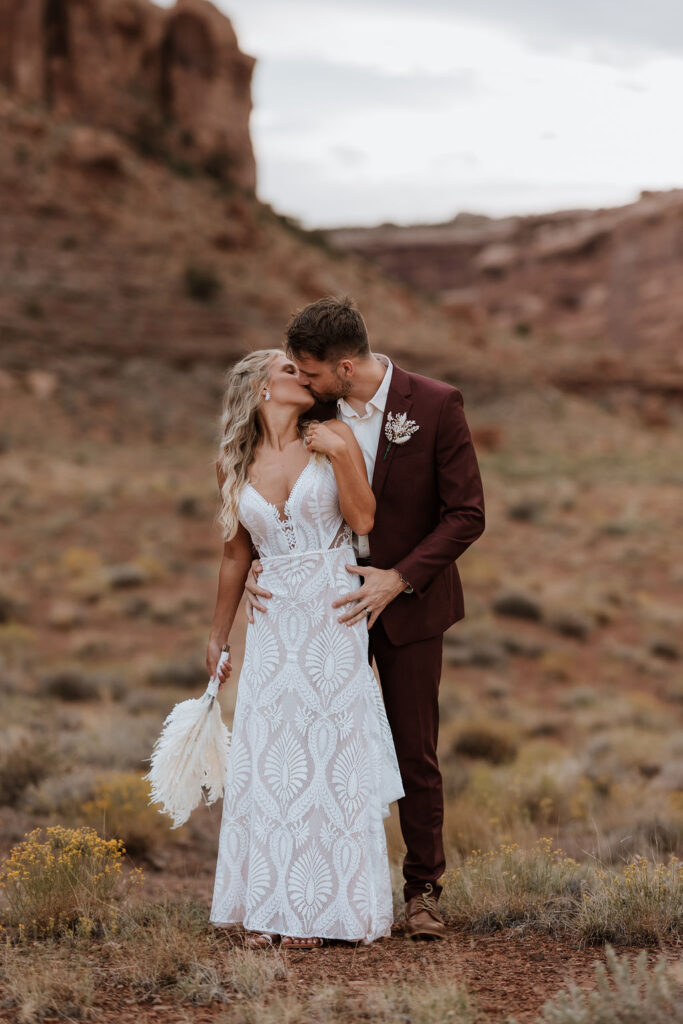 couple kisses at The Red Earth Venue wedding