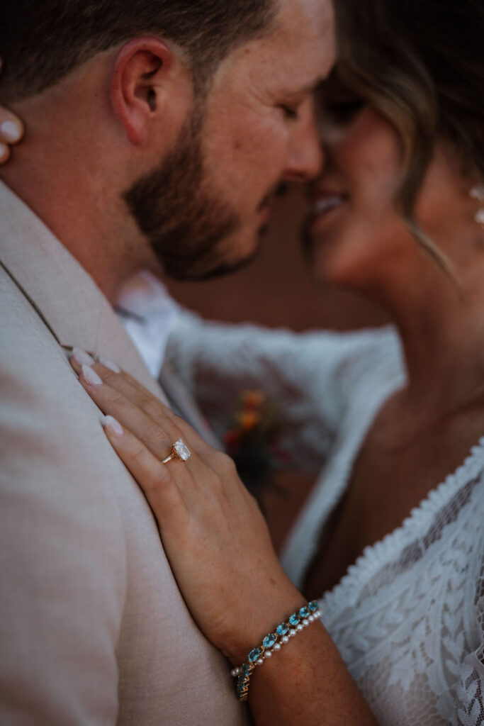 couple kisses at wedding first look