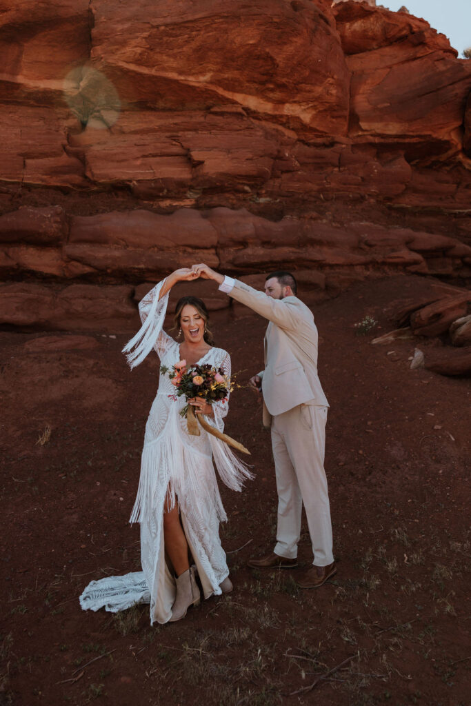 couple twirls at Moab red rock first look