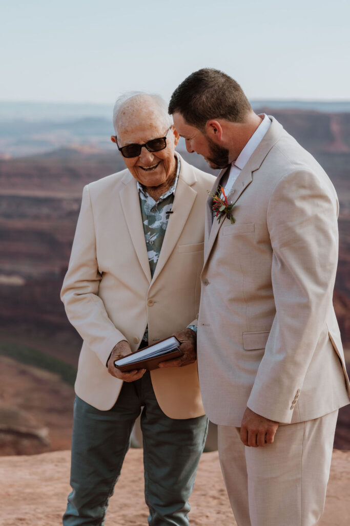 groom laughs with grandpa at Moab elopement