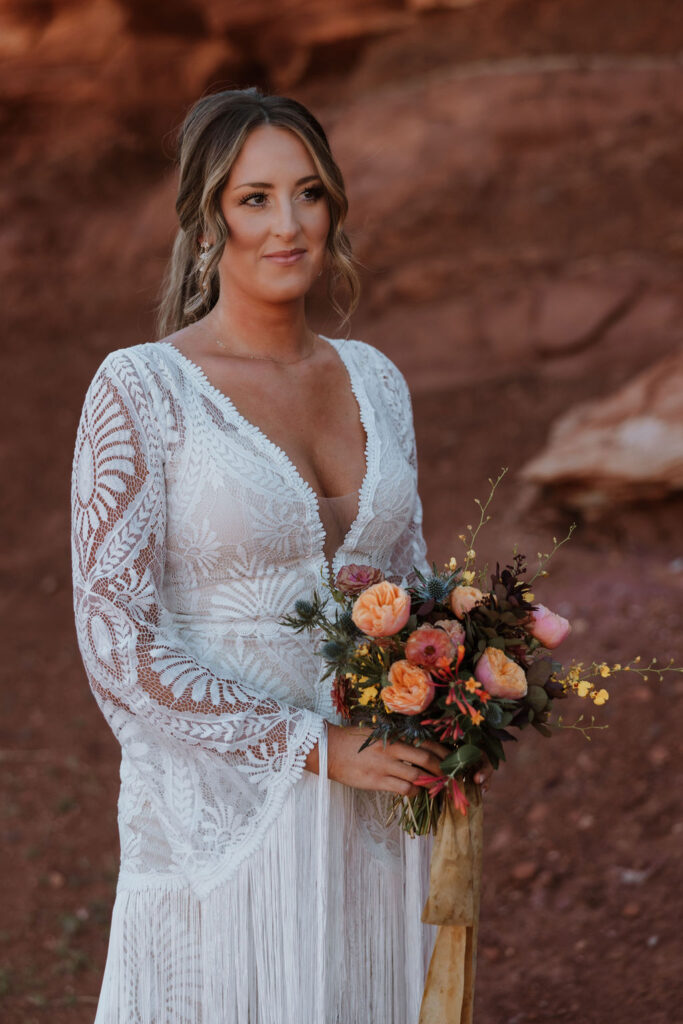 bride holds wedding bouquet at Moab elopement