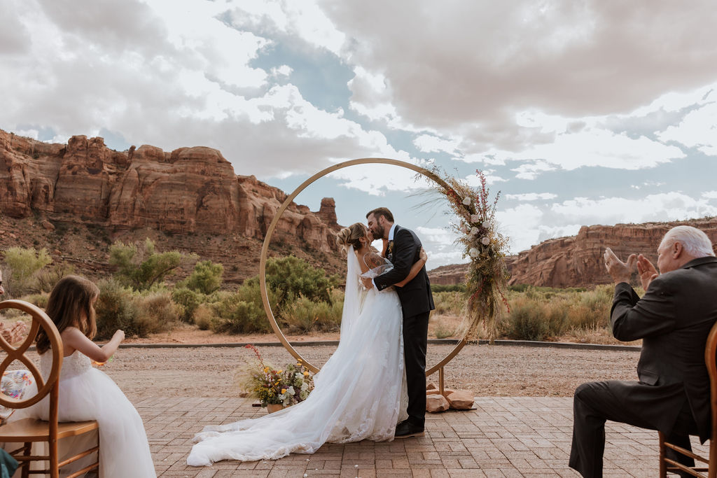 couple kisses at wedding ceremony