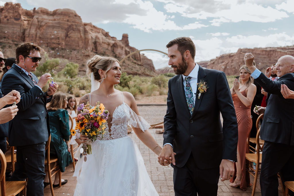 couple holds hands at The Red Earth Venue wedding