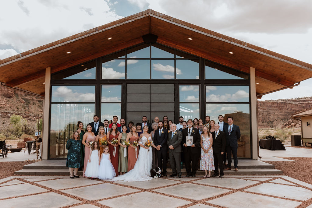 couple poses with guests at The Red Earth Venue wedding