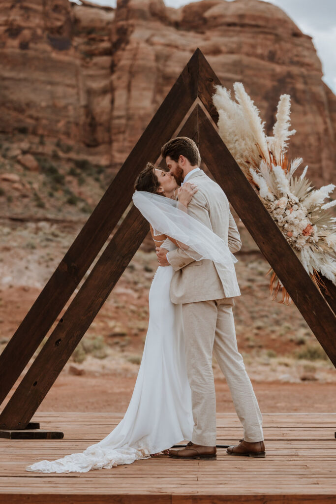 couple kisses at The Red Earth Venue wedding