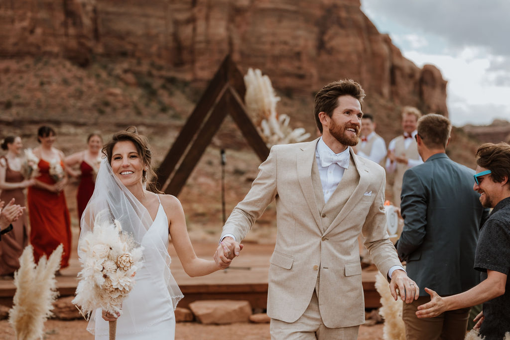 couple exits ceremony at The Red Earth Venue wedding