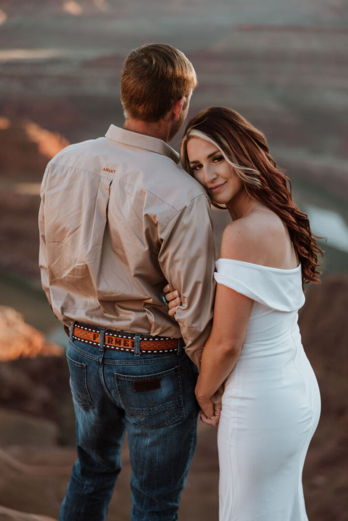 couple embraces at Moab elopement