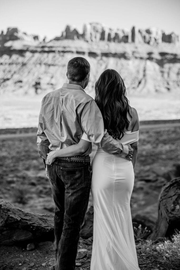 couple embraces during Moab elopement 