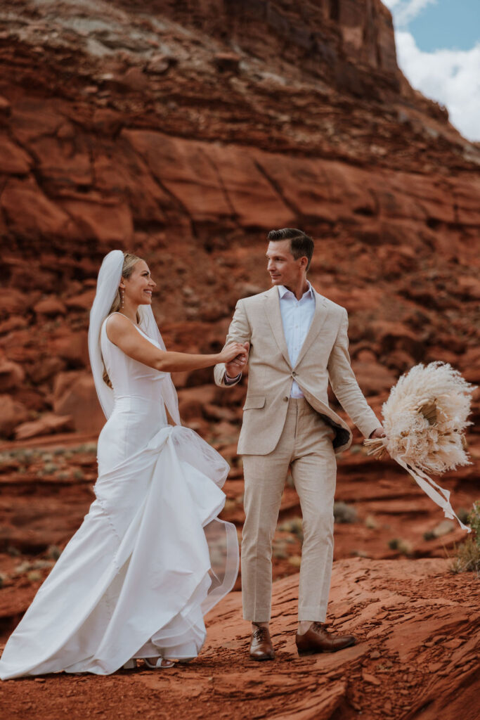 couple walks together at Moab elopement