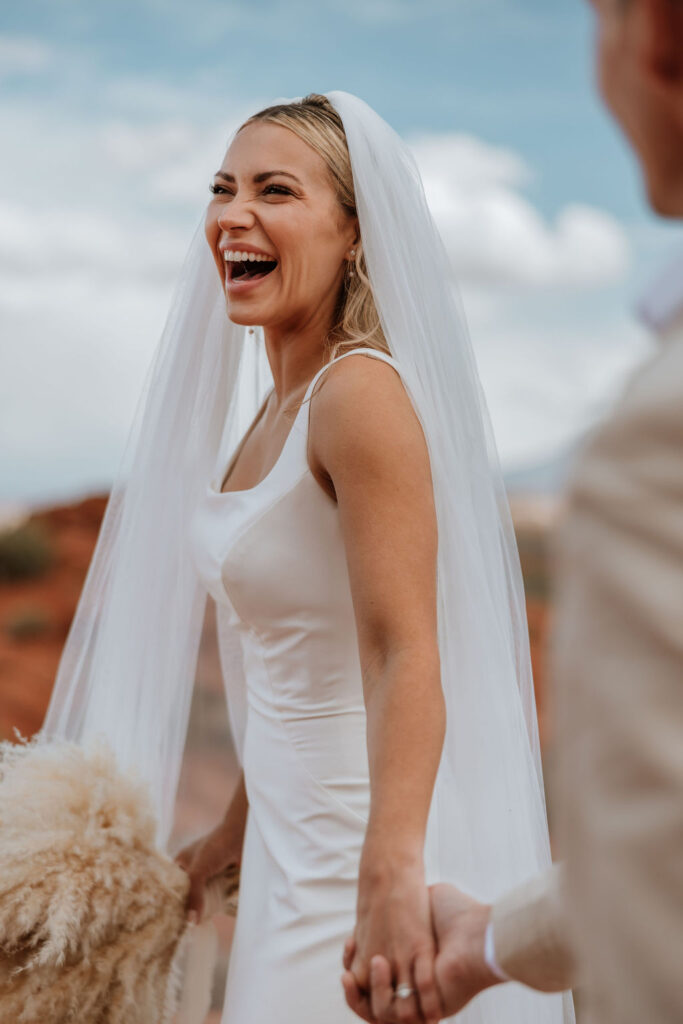 bride laughs at Moab elopement