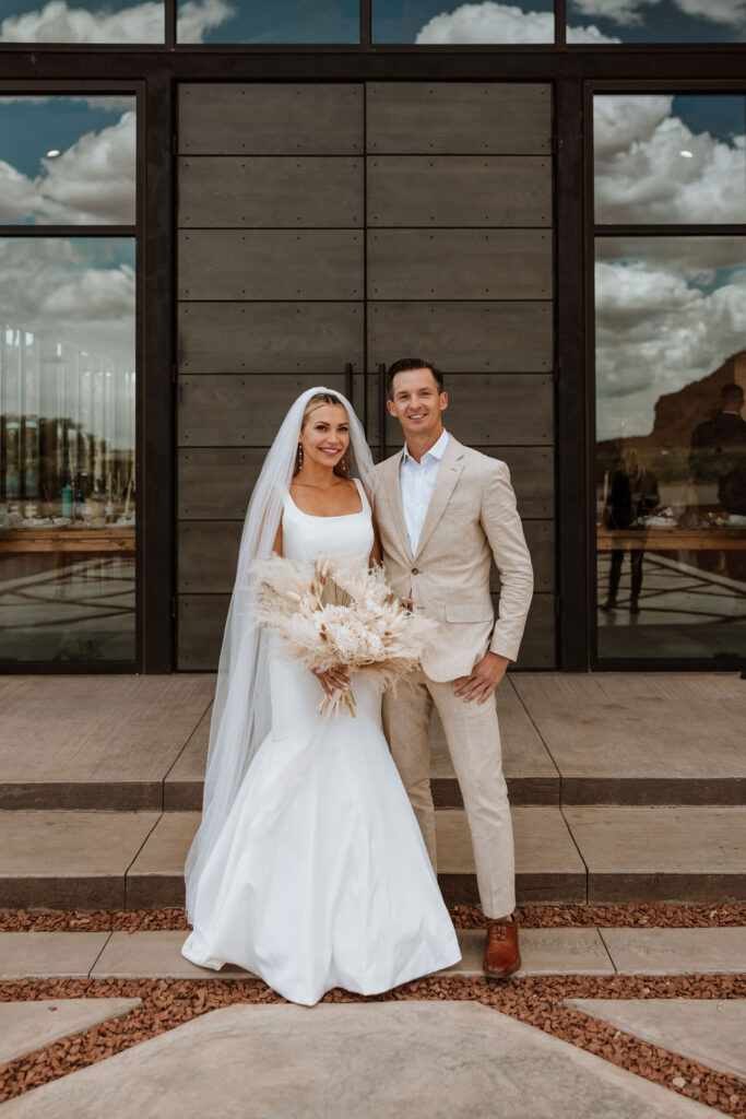 couple poses together at Red Earth Venue wedding
