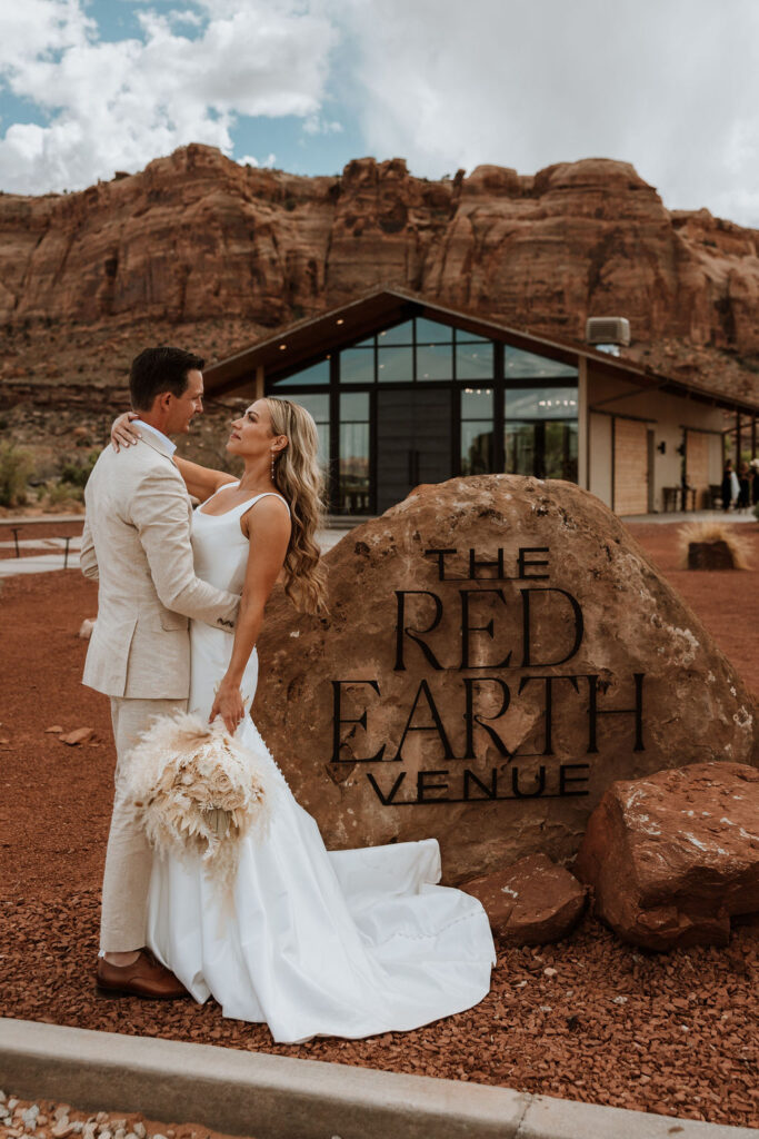 couple embraces at Red Earth Venue wedding
