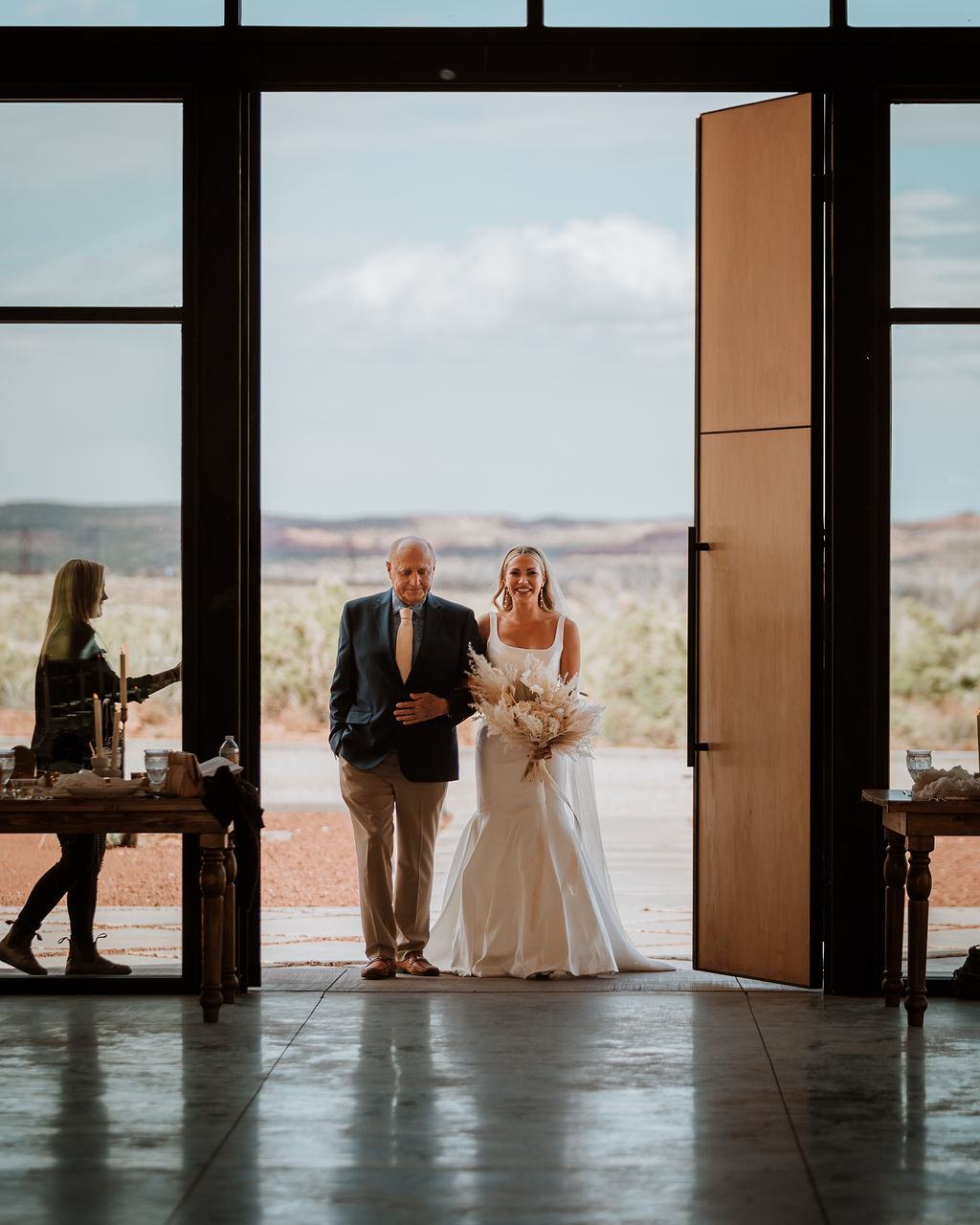 bride walks down the aisle at Red Earth Venue wedding