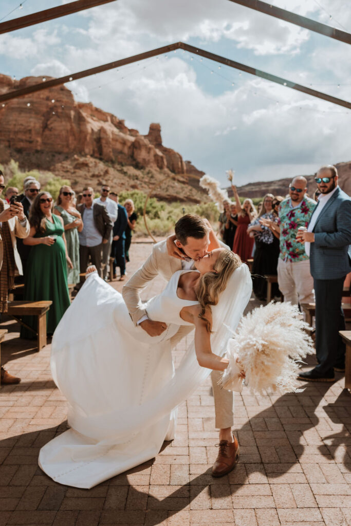 couple kisses at Red Earth Venue wedding