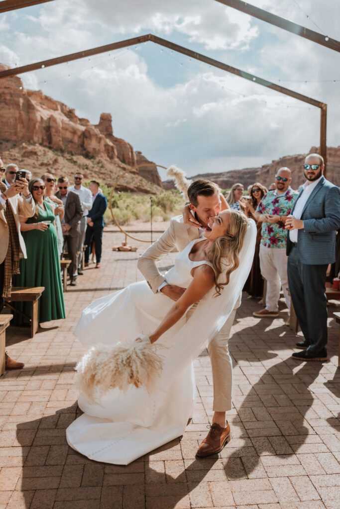 couple kisses at Red Earth Venue wedding