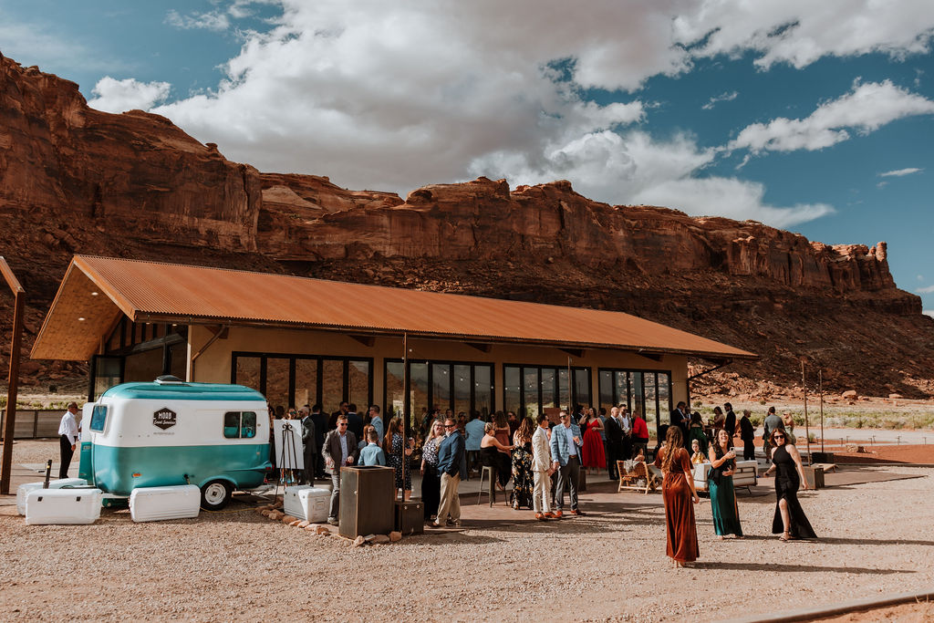 wedding guests drink from trailer at Red Earth Venue wedding