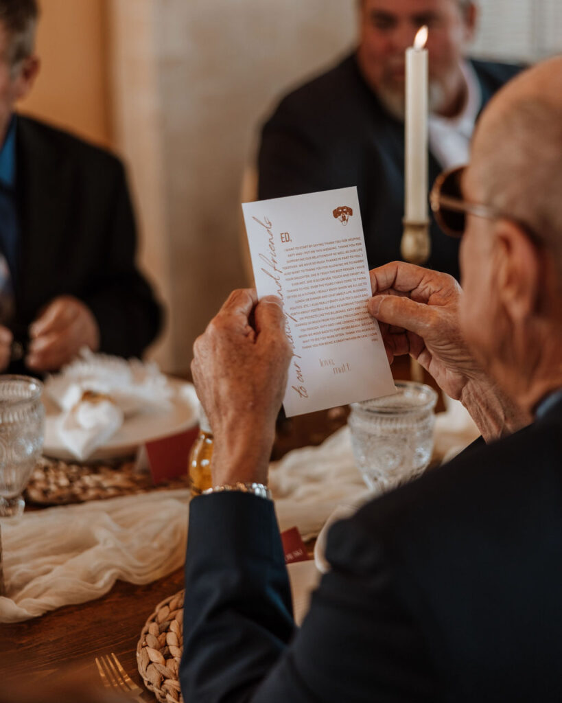 wedding guest reads note from bride and groom