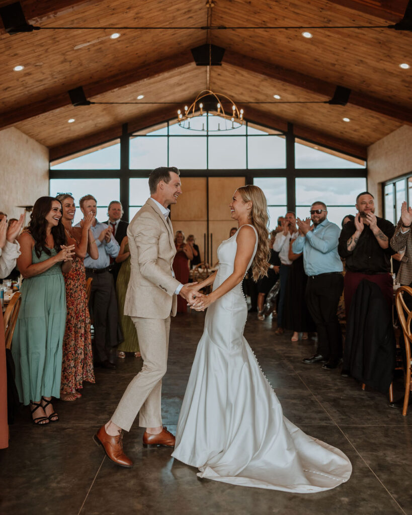 couple holds hands at Red Earth Venue wedding