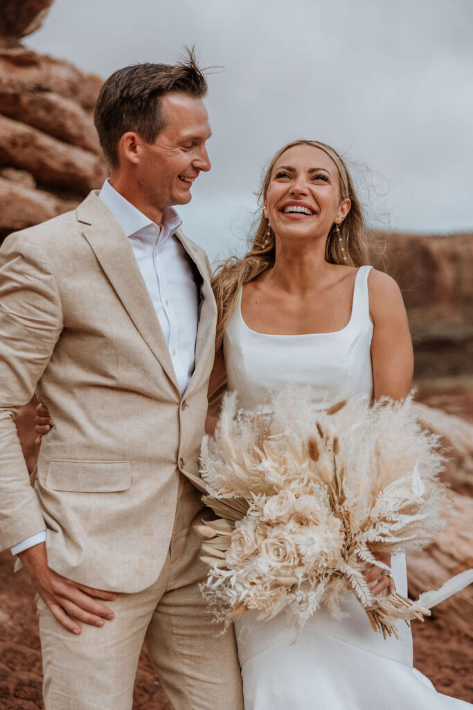 bride laughs together at Moab elopement