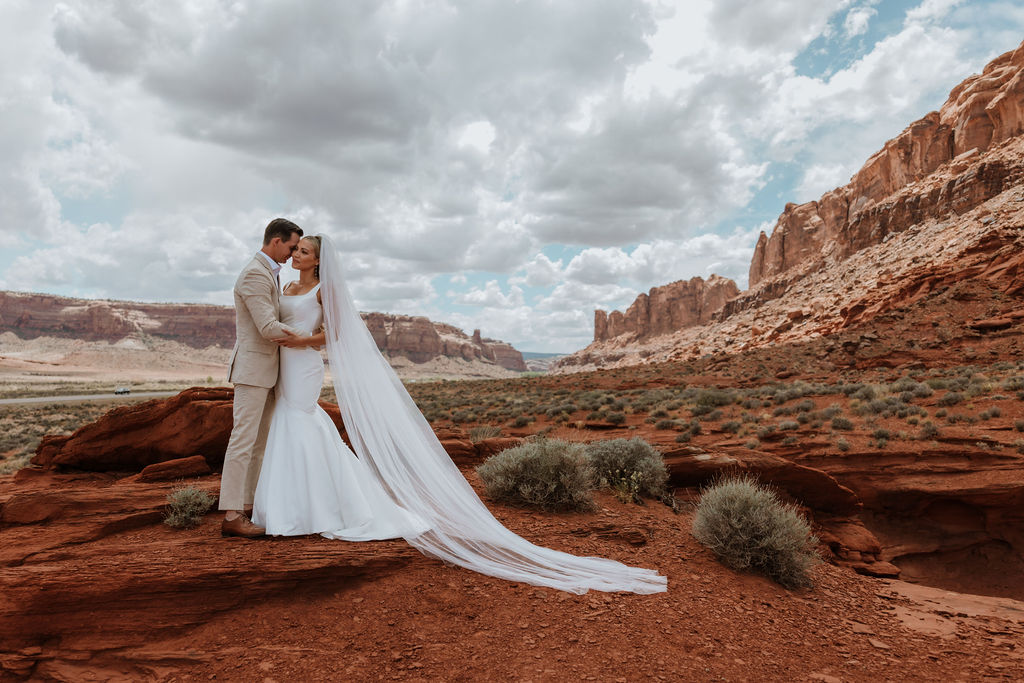 couple embraces at Moab elopement