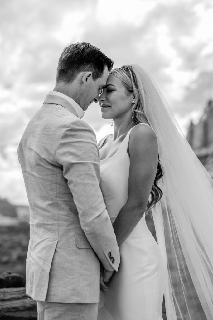 couple embraces at outdoor elopement