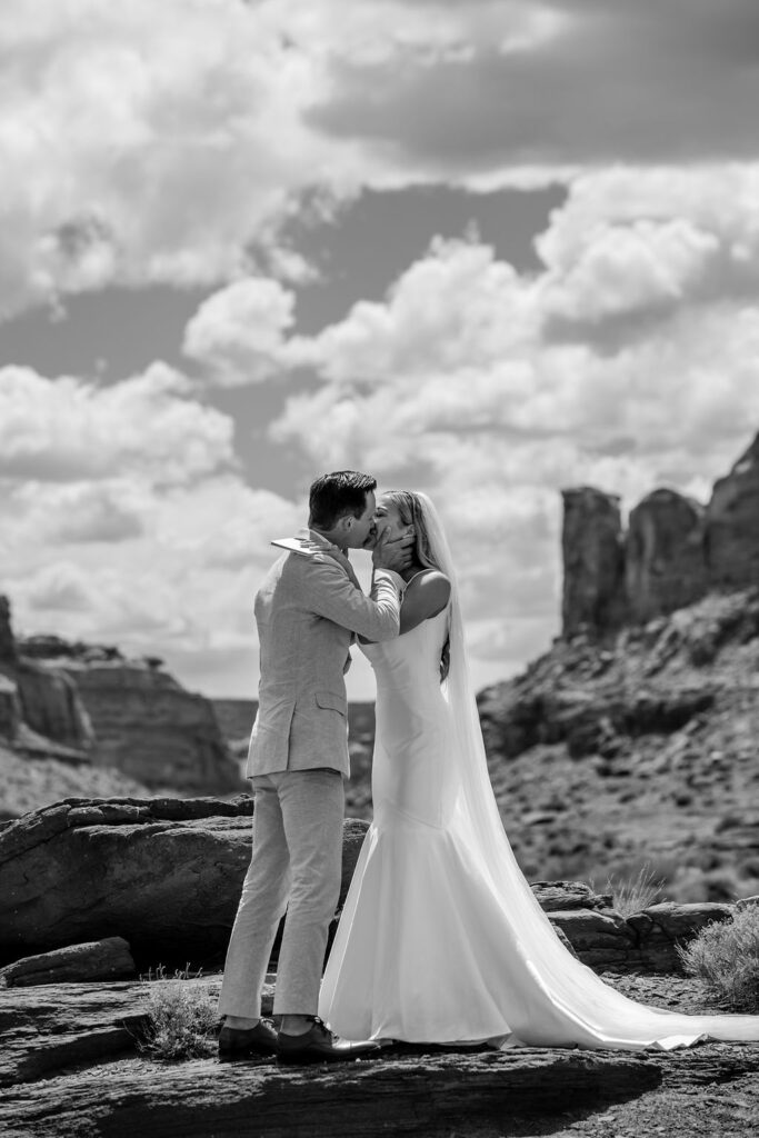 couple kisses at Moab elopement