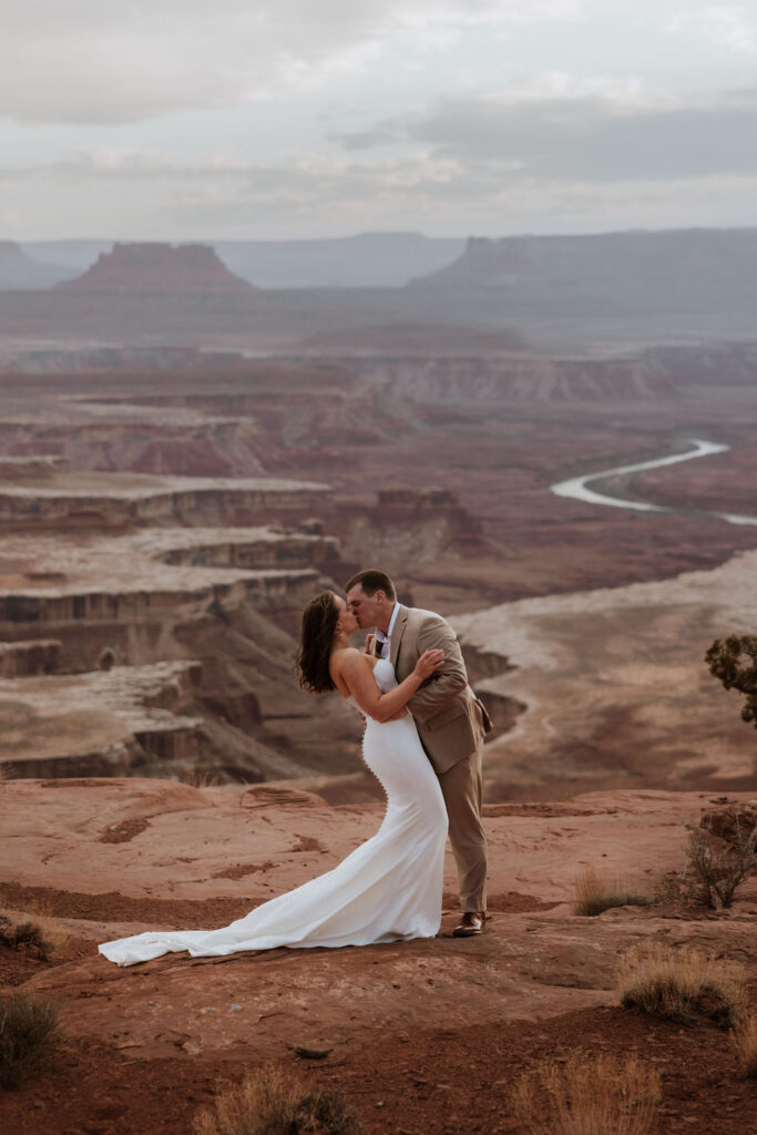 couple kisses at Canyonlands elopement