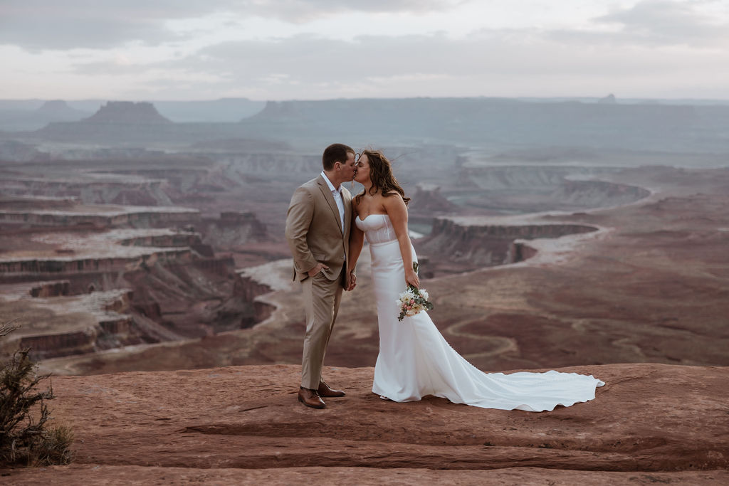 couple kisses at Canyonlands elopement