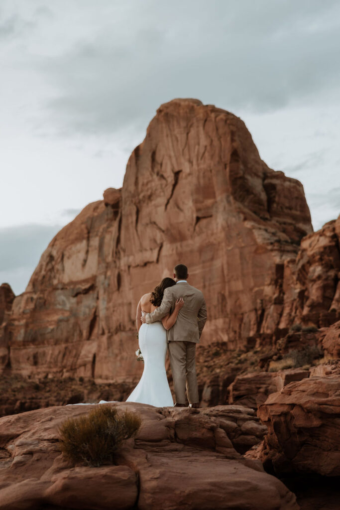 couple embraces at Canyonlands National Park elopement overlook