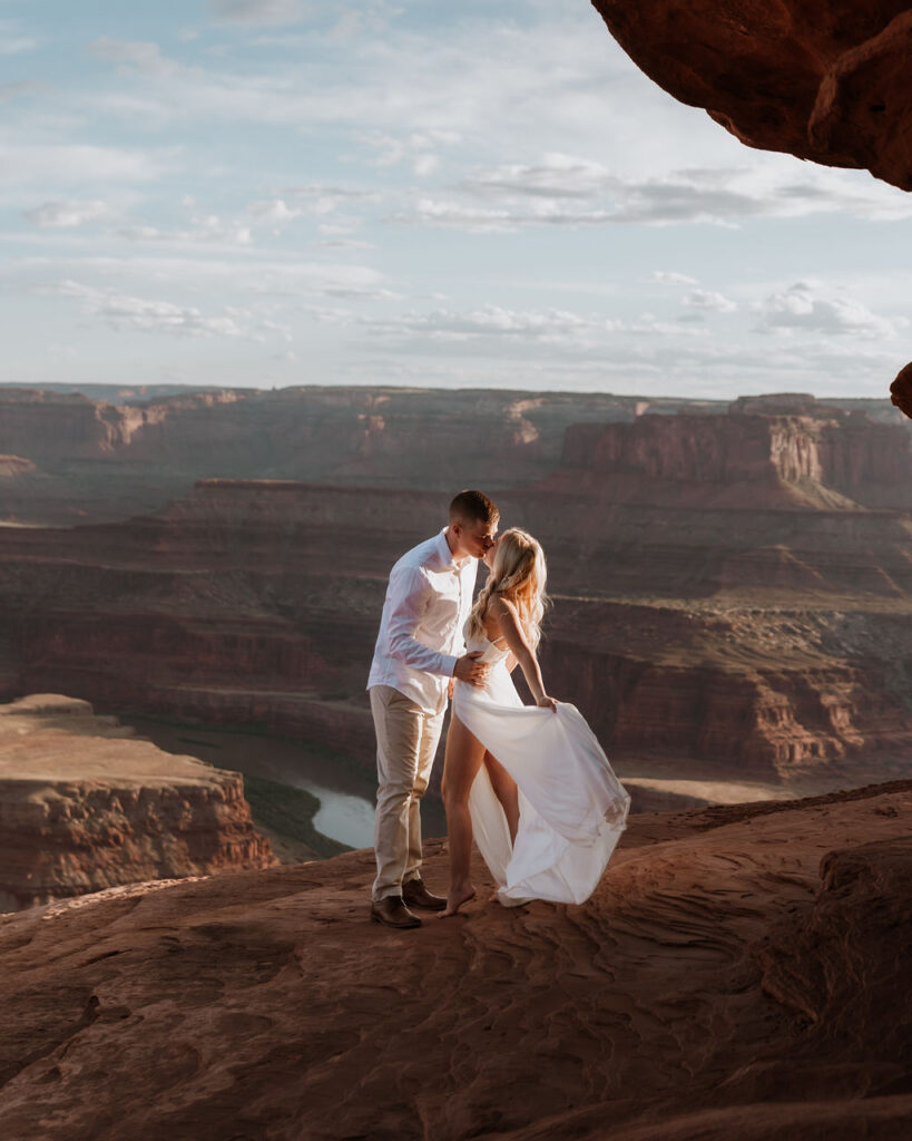 couple kisses at Dead Horse Point State Park elopement