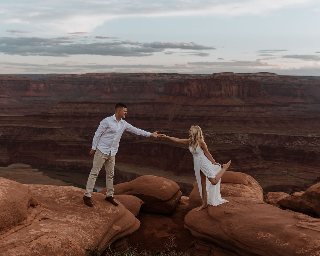 couple holds hands at Dead Horse Point State Park elopement