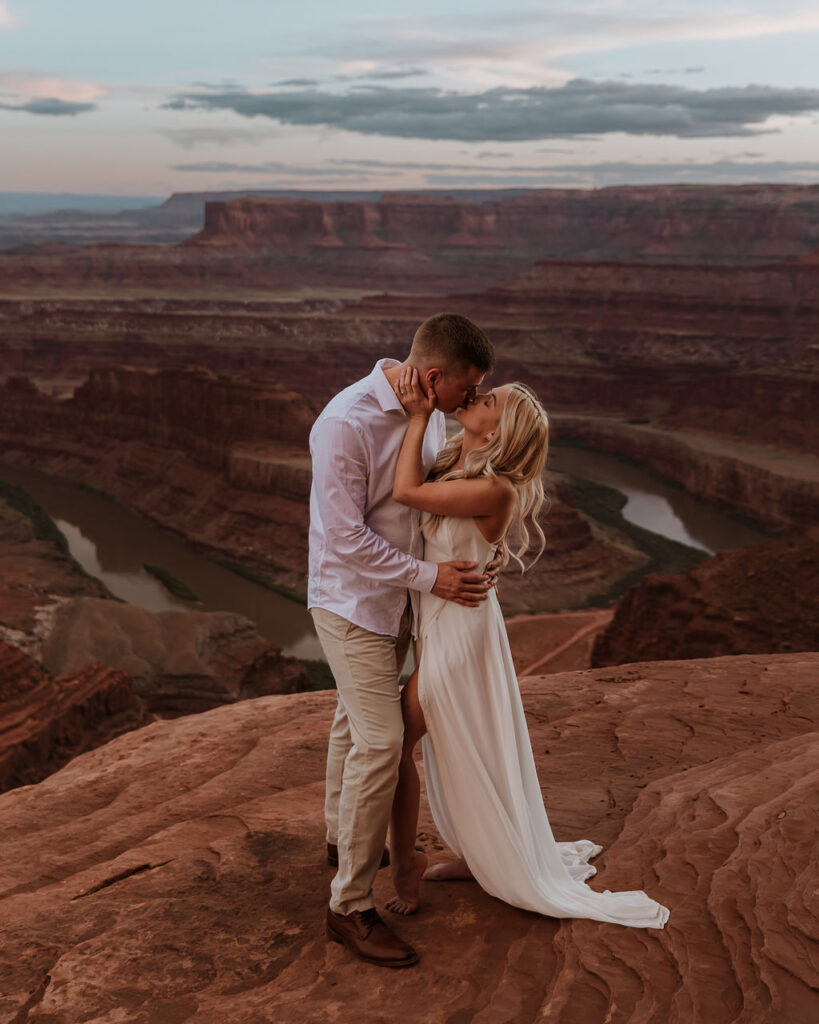 couple kisses at Dead Horse Point State Park elopement