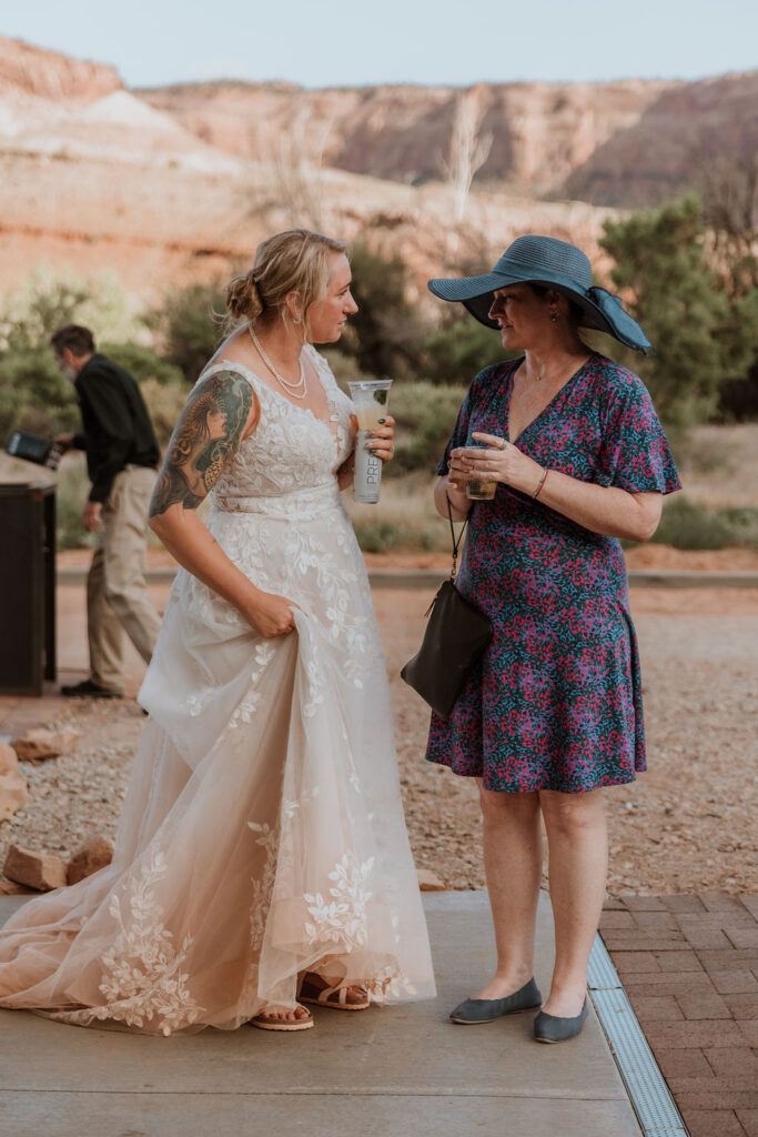 bride has cocktail hour with guest at the Red Earth Venue wedding