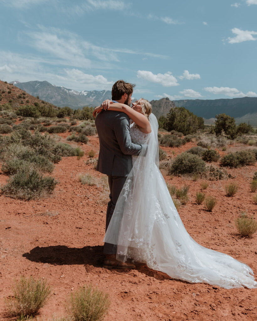 couple kisses at Castle Valley wedding first look