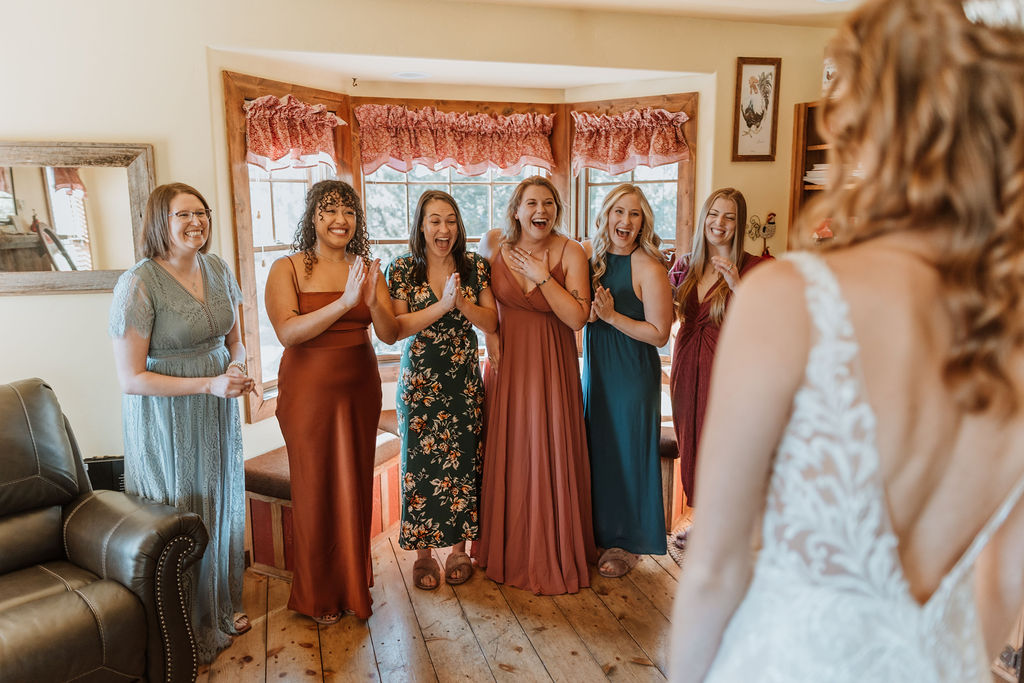 bride has bridesmaids wedding first look 