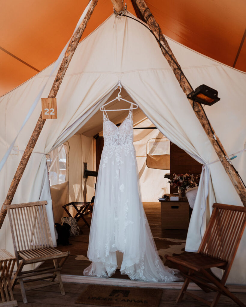 wedding dress hanging on yurt at Under Canvas Moab