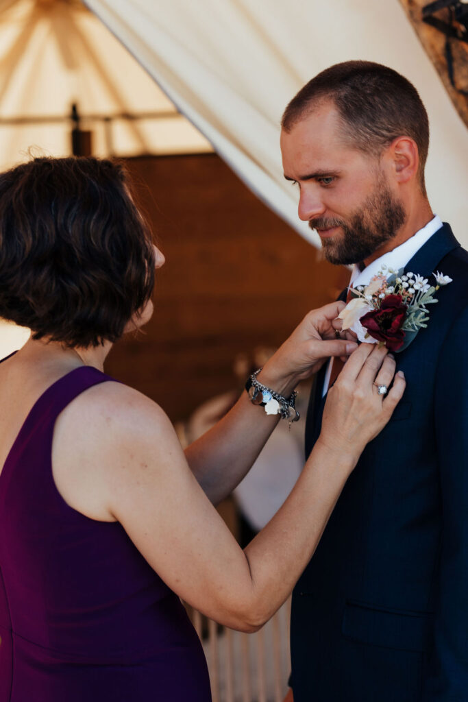 groom gets ready at a top where to stay in Moab location